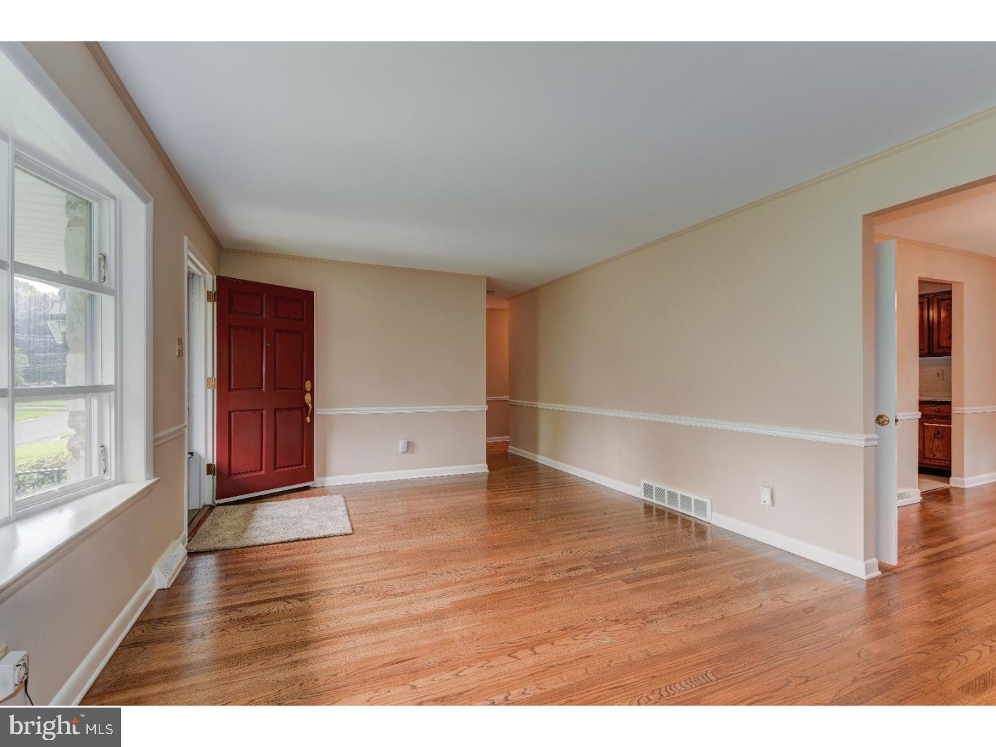 55 Home Road Hatboro, PA 19040 - Photo 4 of 23 a view of an empty room with wooden floor and a window