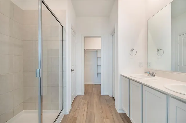 a bathroom with a sink a vanity and a mirror