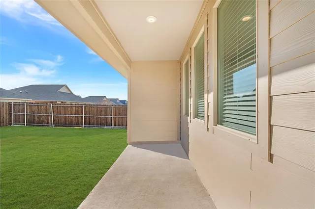 a view of a backyard with plants and a garden