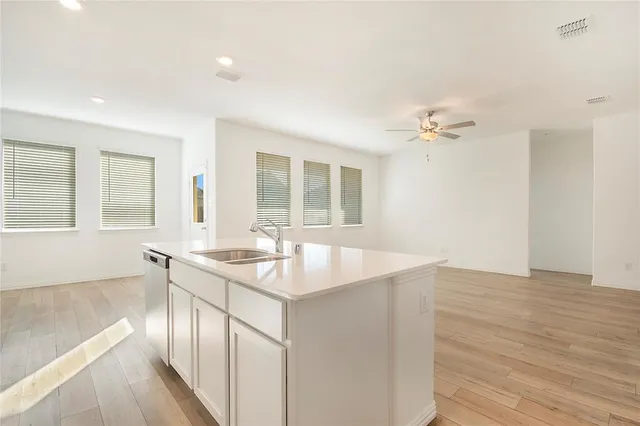 a room with a sink and chandelier