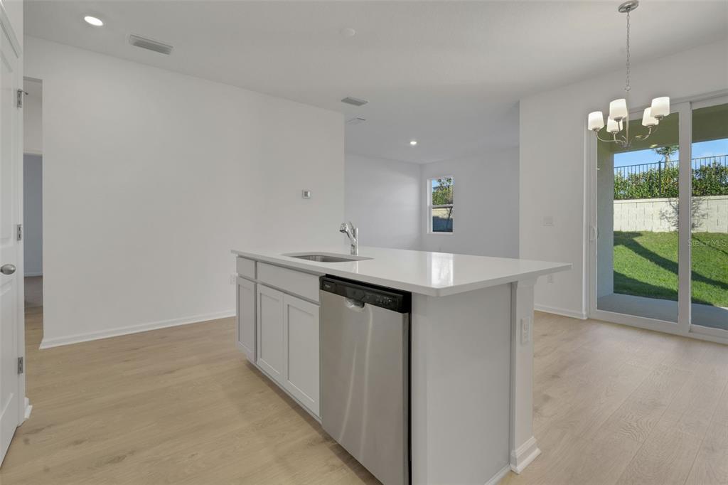 2824 Doolittle Street Tavares, FL 32778 - Photo 16 of 32 a kitchen with a sink cabinets and window