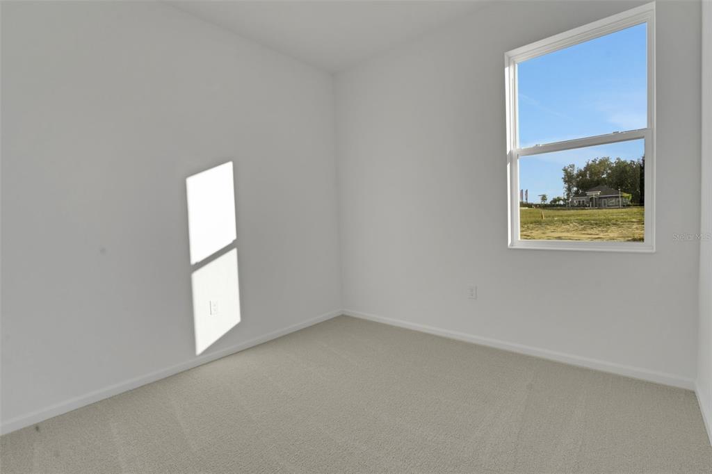 2824 Doolittle Street Tavares, FL 32778 - Photo 26 of 32 an empty room with windows