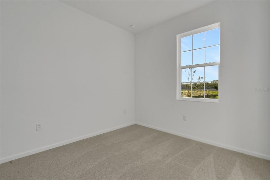 2824 Doolittle Street Tavares, FL 32778 - Photo 29 of 32 an empty room with a window