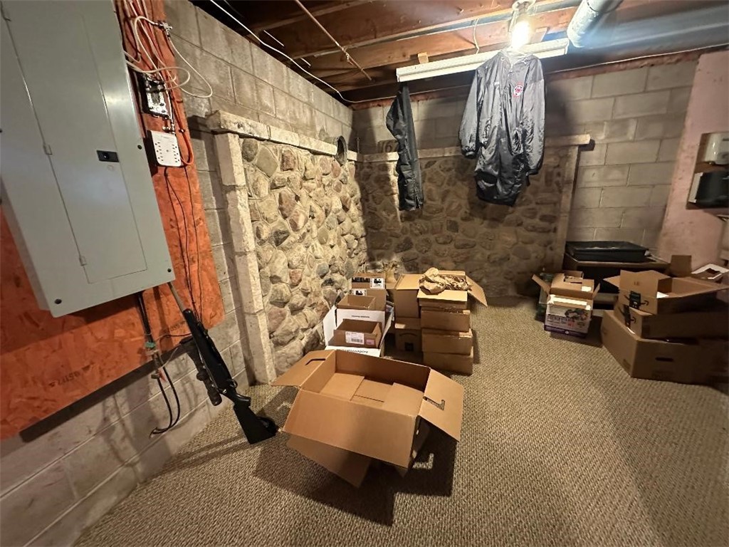 16711 4th Section Road Clarendon, NY 14470 - Photo 22 of 30 Basement Rock Wall - Woodstove Piping