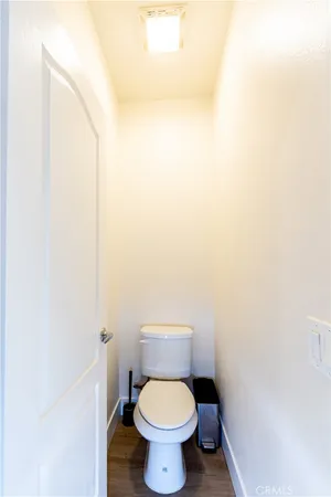 a white toilet sitting in a bathroom