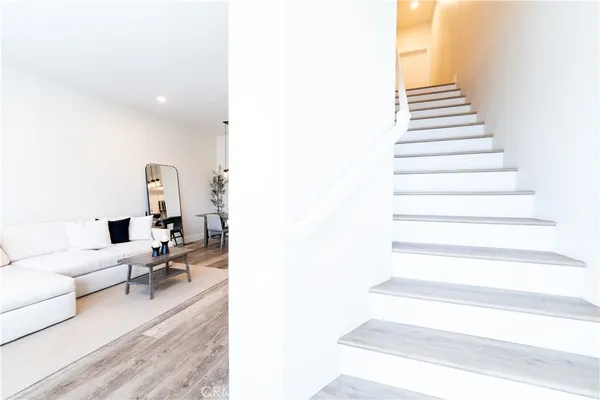 a living room with furniture and white walls