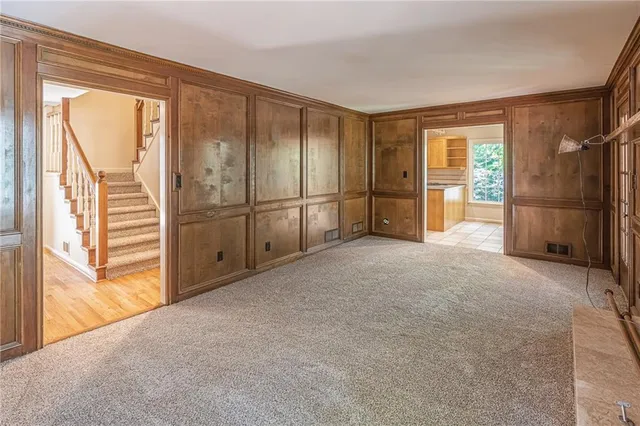 a view of an empty room with a fireplace