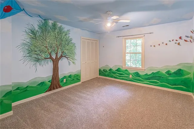 a view of a house with a yard and plant