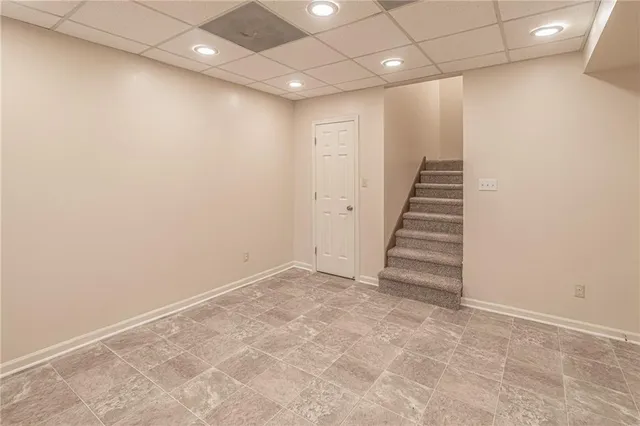 an empty room with stairs and ventilation