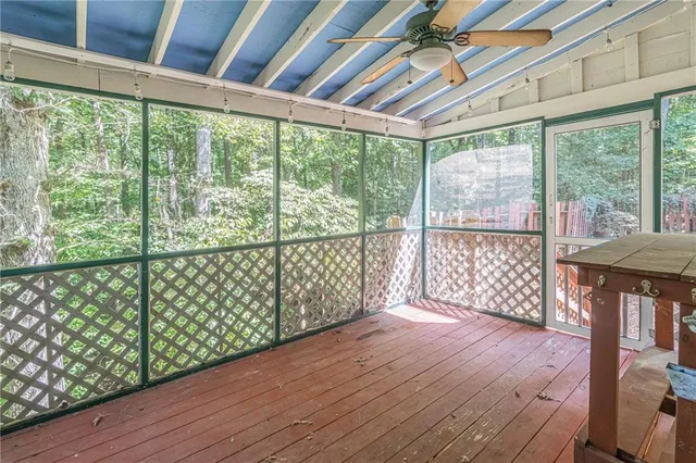a view of a porch with wooden floor and outdoor space