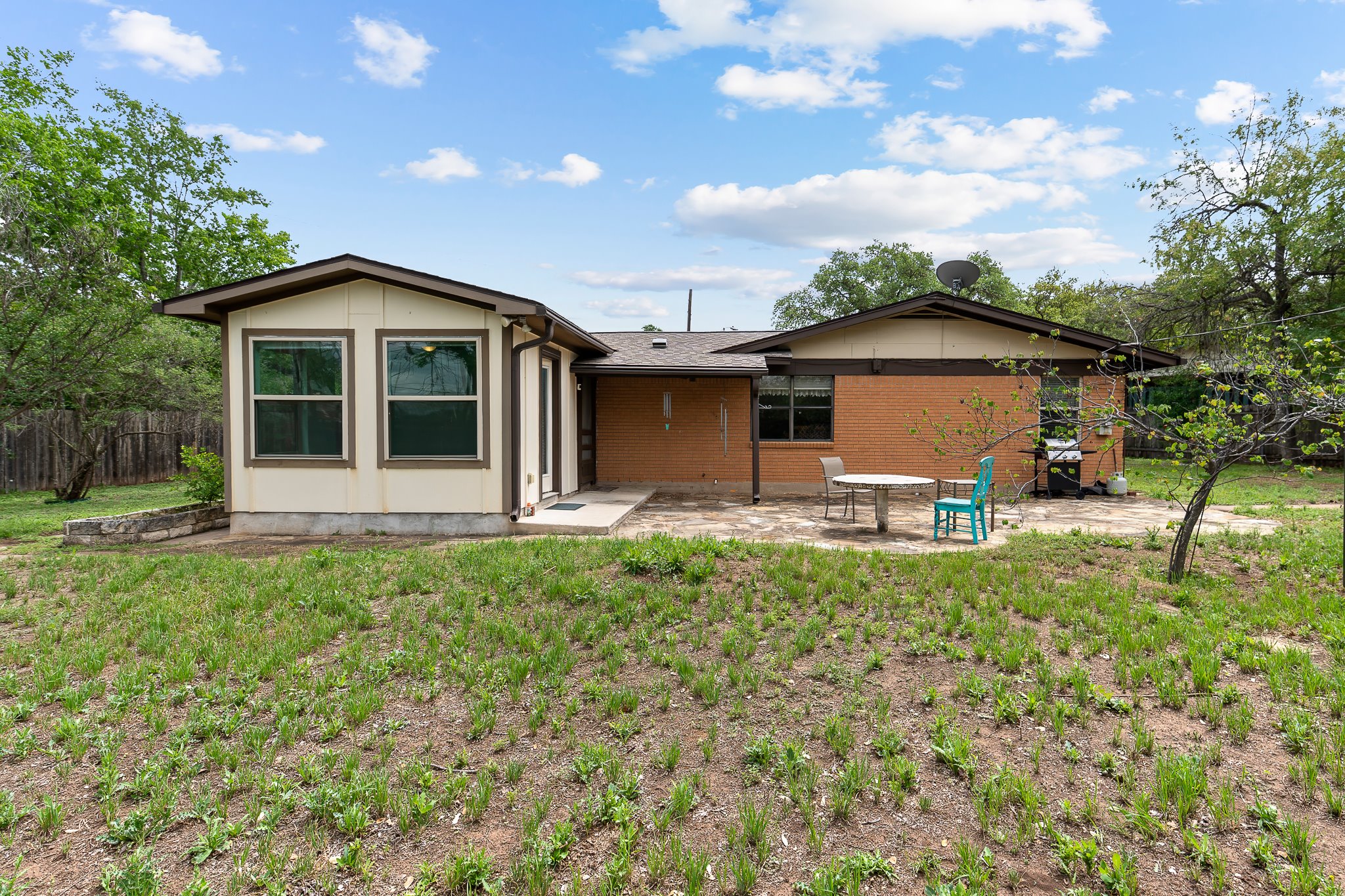 5600 Libyan Circle Austin, TX 78745 - Photo 37 of 37 Back of house with a patio area and brick siding