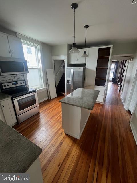 8 East Main Street, Unit MAIN Shiremanstown, PA 17011 - Photo 2 of 25 a living room with furniture and a fireplace