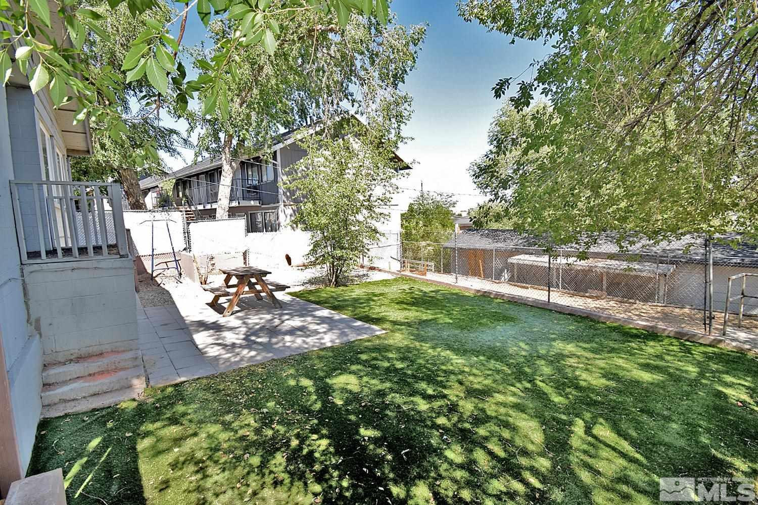 486 Highland Avenue Reno, NV 89512 - Photo 30 of 33 a view of a backyard with table and chairs and a tree