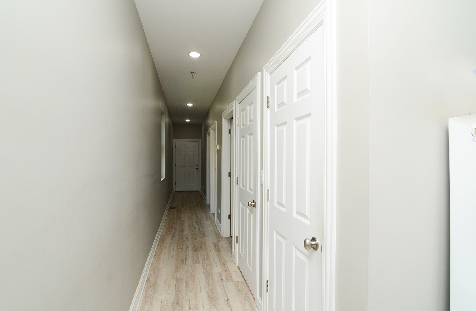 1051 North Springfield Avenue Chicago, IL 60651 - Photo 42 of 50 a view of a hallway with wooden floor