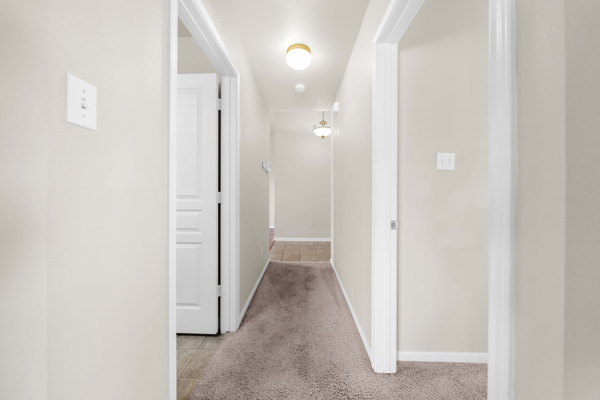 7719 Fieldstone Drive Temple, TX 76502 - Photo 10 of 37 Corridor featuring light colored carpet and light tile patterned flooring
