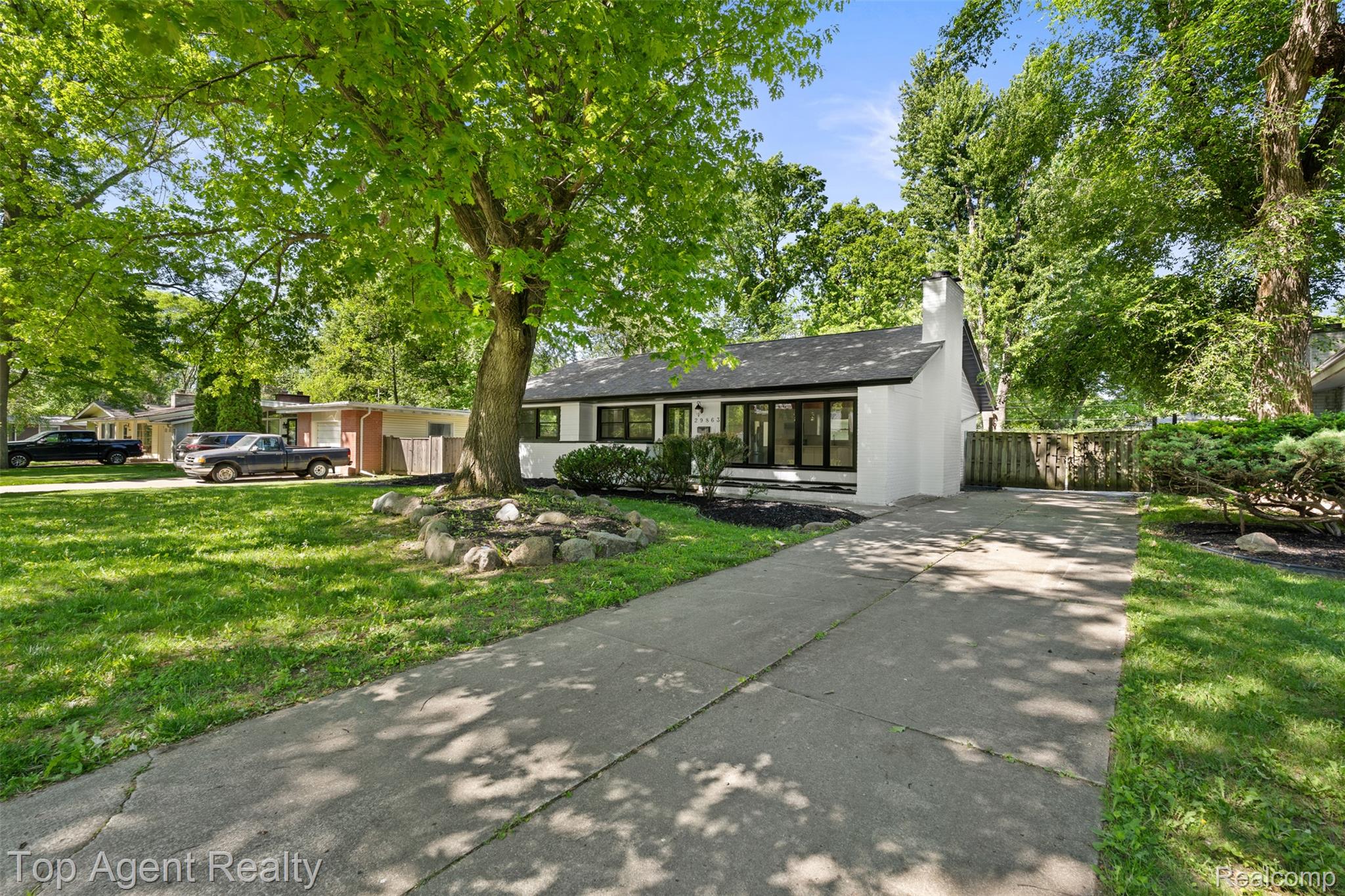 29863 Fall River Road Southfield, MI 48076 - Photo 40 of 50 Contemporary single-story residence with a white stucco exterior and black trim