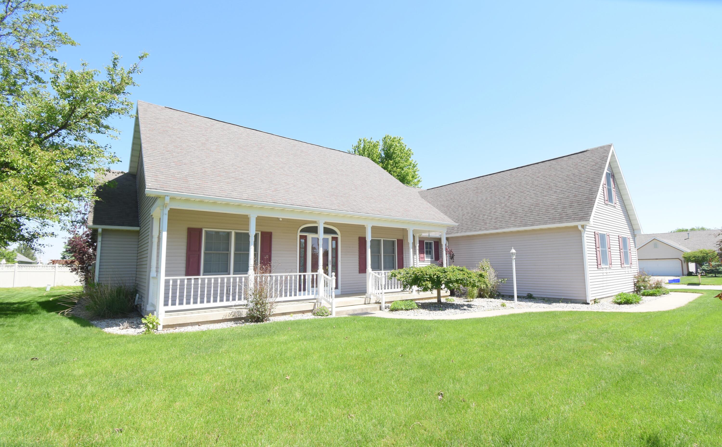 522 Pheasant Run Rensselaer, IN 47978 - Photo 2 of 55 a front view of a house with a garden and yard