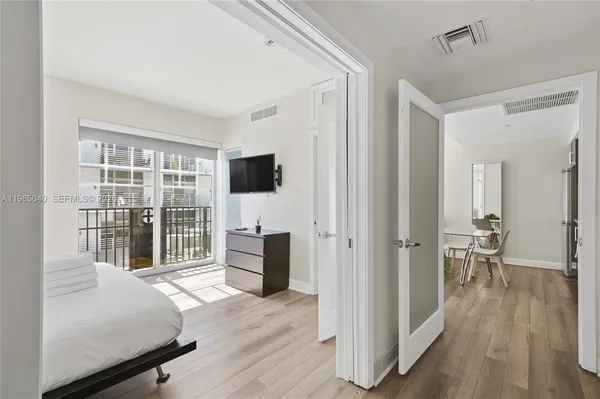 a bedroom with a bed and furniture