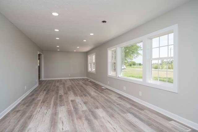 445 Pocahontas Road Morrison, TN 37357 - Photo 12 of 16 a view of an empty room with wooden floor and a window