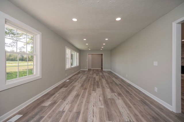 445 Pocahontas Road Morrison, TN 37357 - Photo 13 of 16 a view of empty room with wooden floor and fan