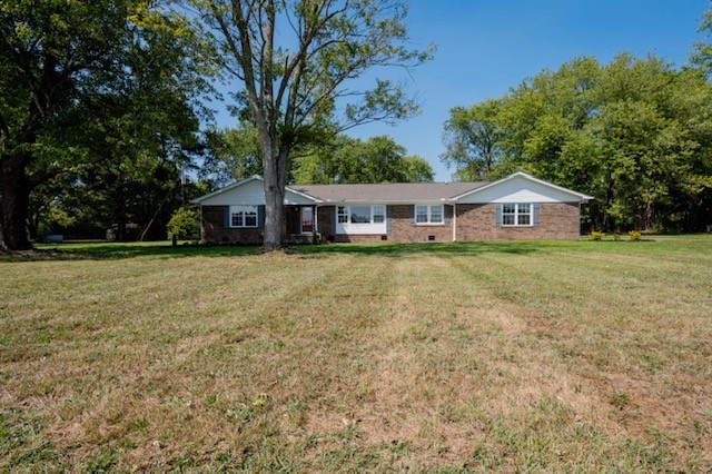 445 Pocahontas Road Morrison, TN 37357 - Photo 16 of 16 a view of a house with a big yard and large trees
