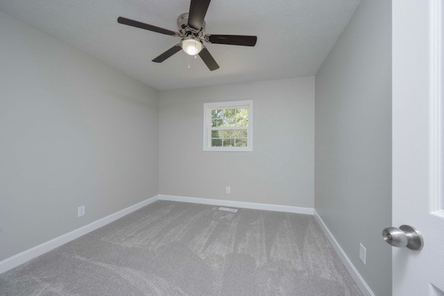 445 Pocahontas Road Morrison, TN 37357 - Photo 6 of 16 an empty room with a window and a fan