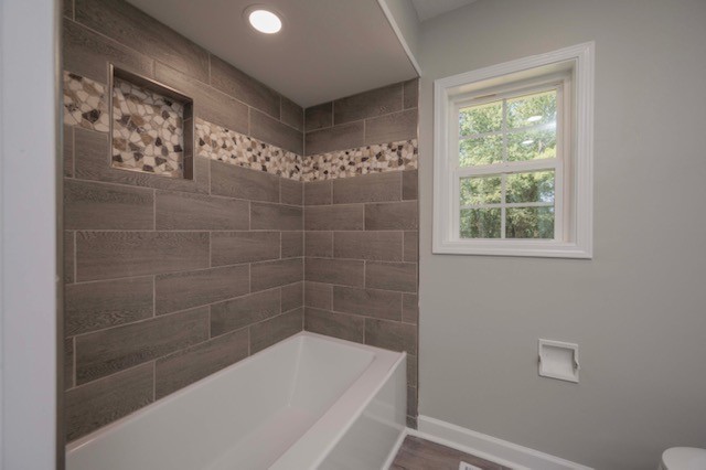 445 Pocahontas Road Morrison, TN 37357 - Photo 7 of 16 a bathroom with a bathtub and window