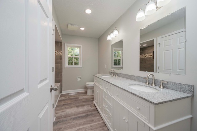 445 Pocahontas Road Morrison, TN 37357 - Photo 8 of 16 a en suite bathroom with a granite countertop sink and a mirror