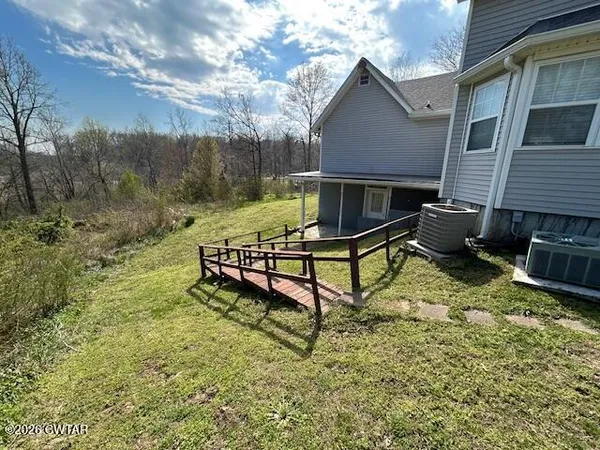 a view of a patio with a yard