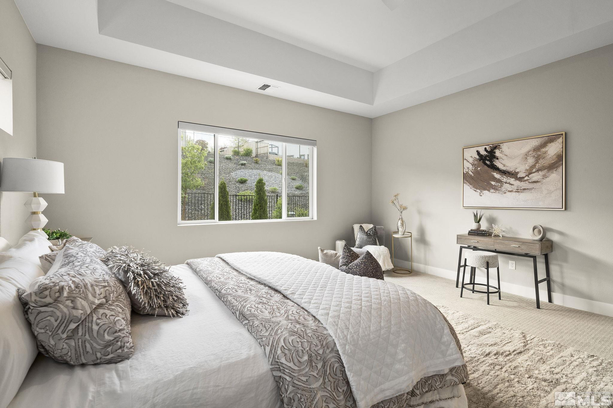 2936 Ruby Desert Drive Reno, NV 89521 - Photo 21 of 40 a bedroom with a bed and a painting on the wall