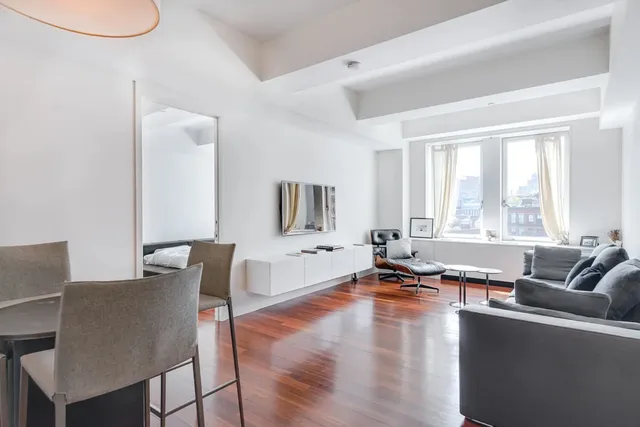 a black and white photo of a living room
