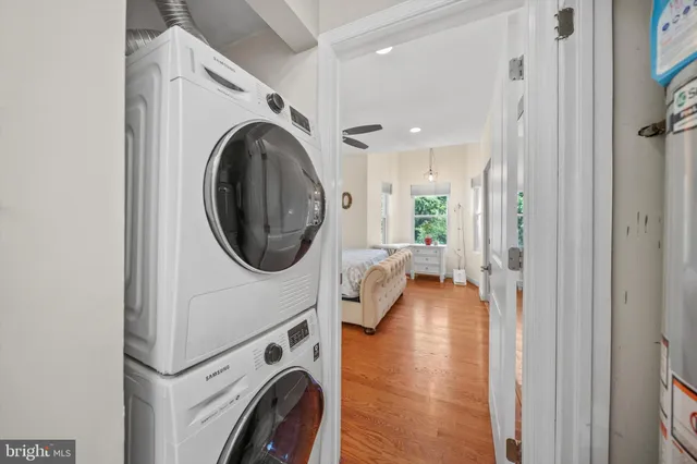 a view of a hallway with washer and dryer