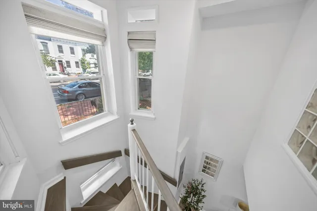 a view of an entryway with wooden floor
