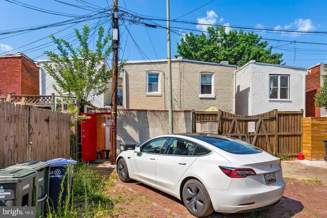a car parked in front of a house