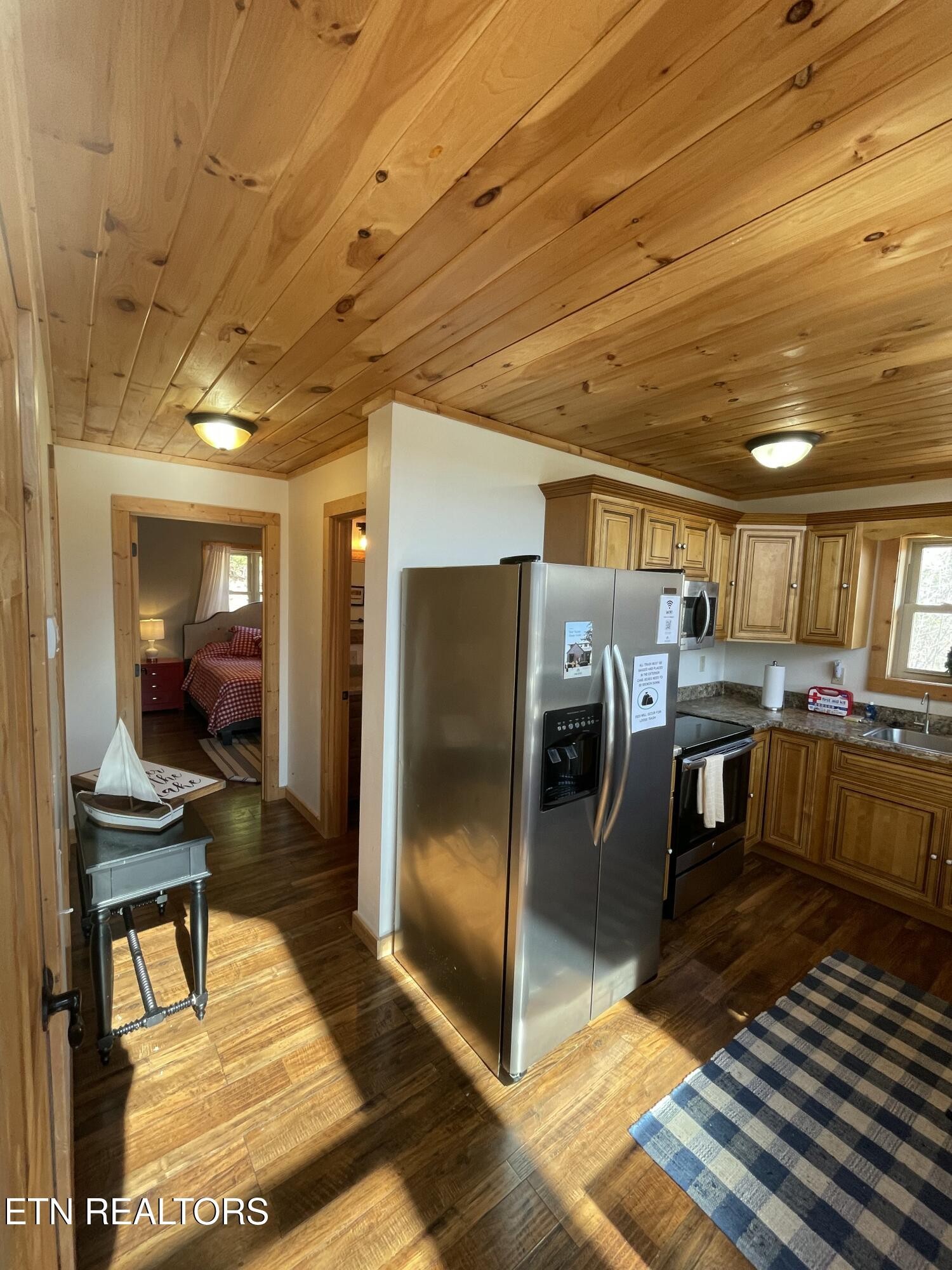 625 Bluff View Road New Tazewell, TN 37825 - Photo 18 of 57 a kitchen with stainless steel appliances kitchen island granite countertop a refrigerator and stove