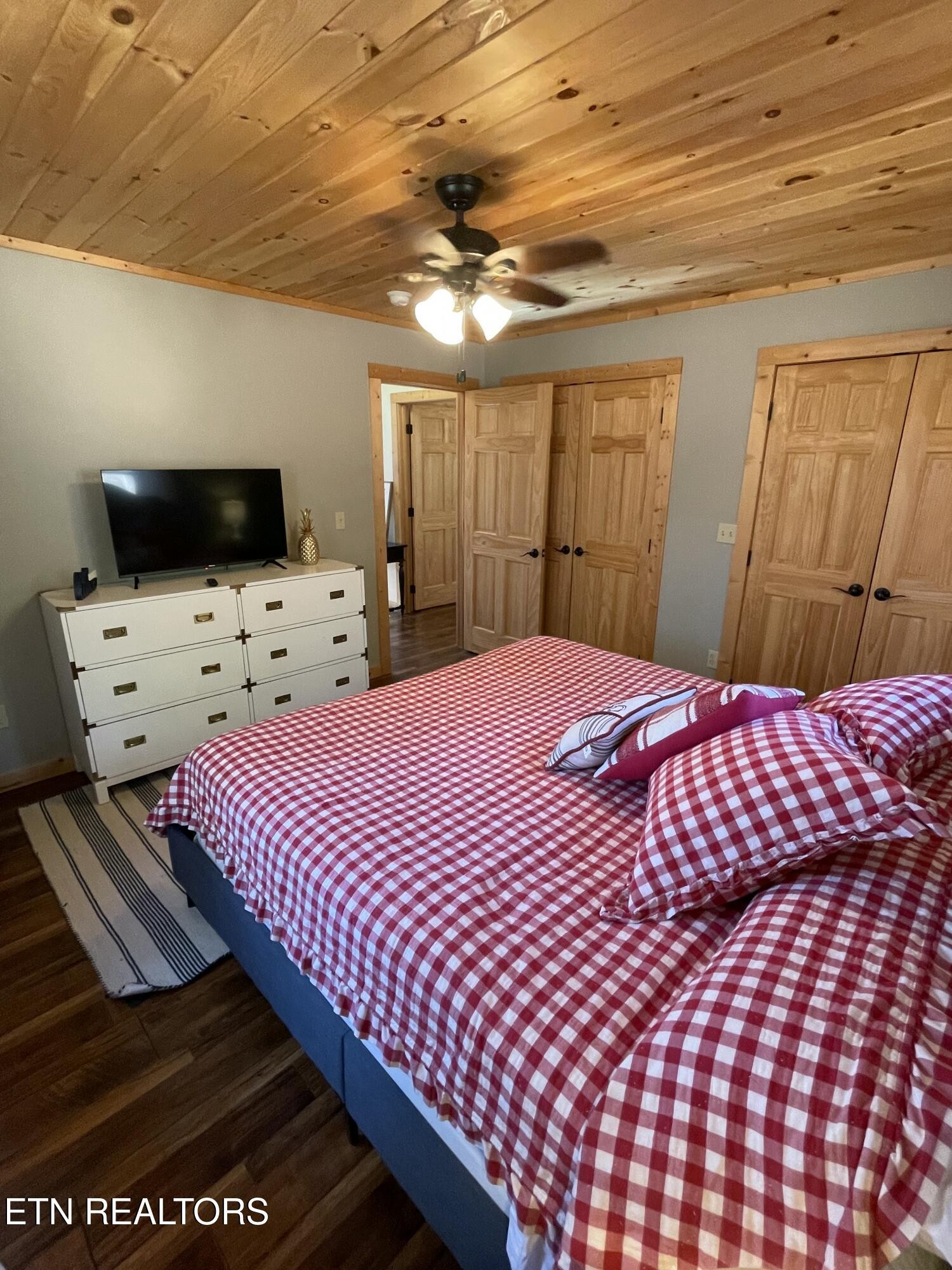 625 Bluff View Road New Tazewell, TN 37825 - Photo 25 of 57 a bedroom with a bed and a flat screen tv