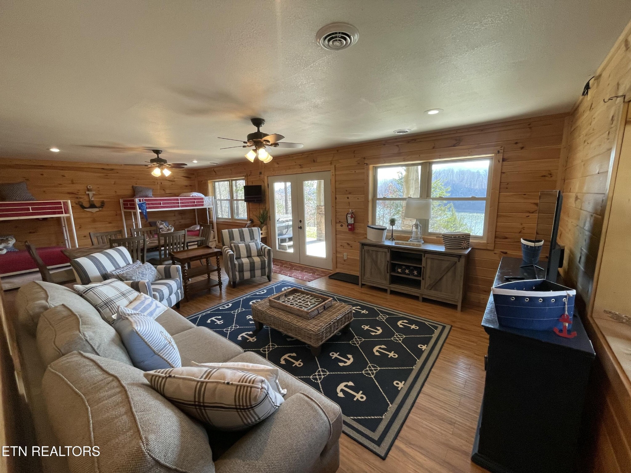 625 Bluff View Road New Tazewell, TN 37825 - Photo 26 of 57 a living room with furniture and a flat screen tv