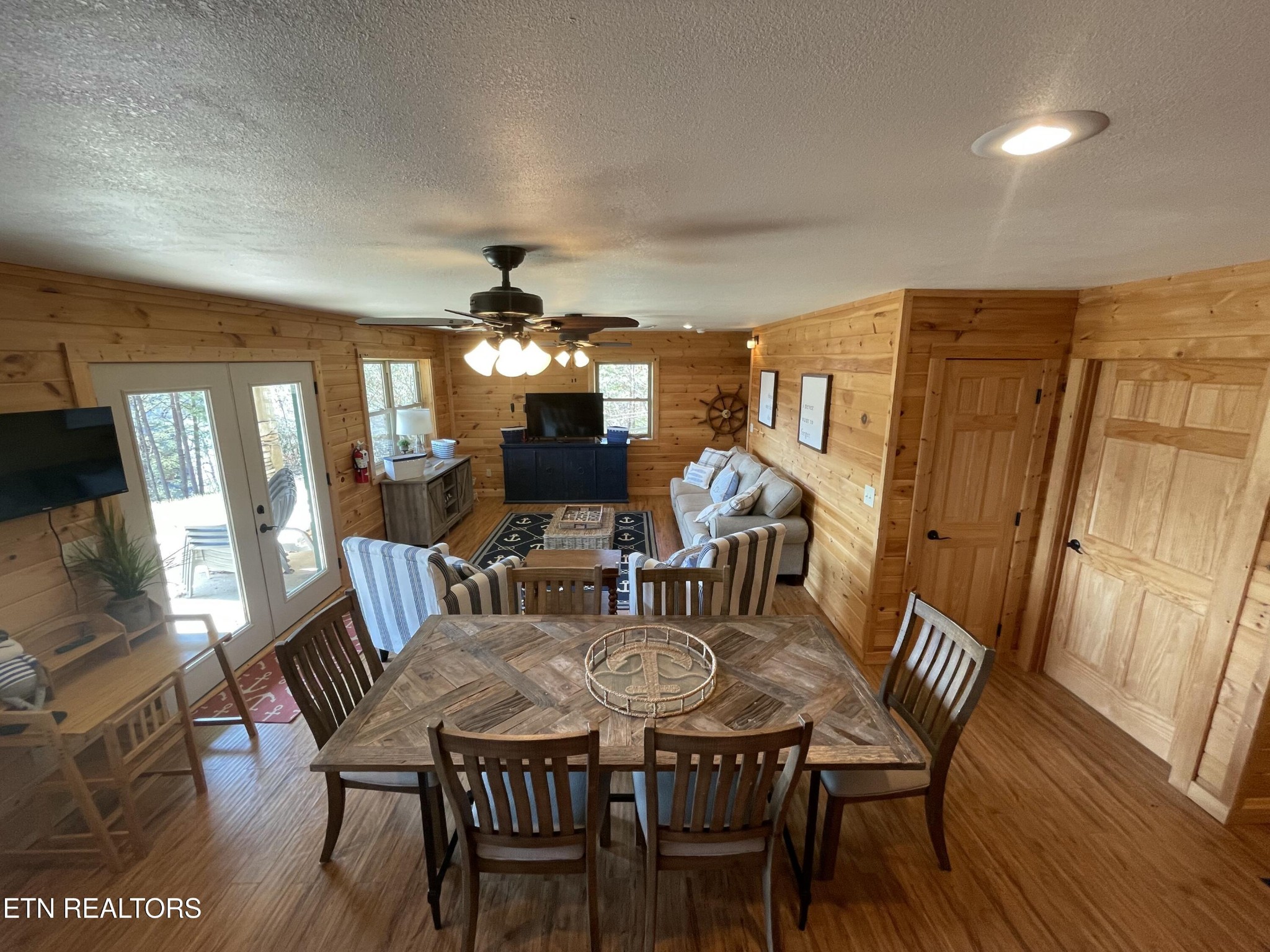 625 Bluff View Road New Tazewell, TN 37825 - Photo 28 of 57 a view of a dining room with furniture wooden floor and chandelier