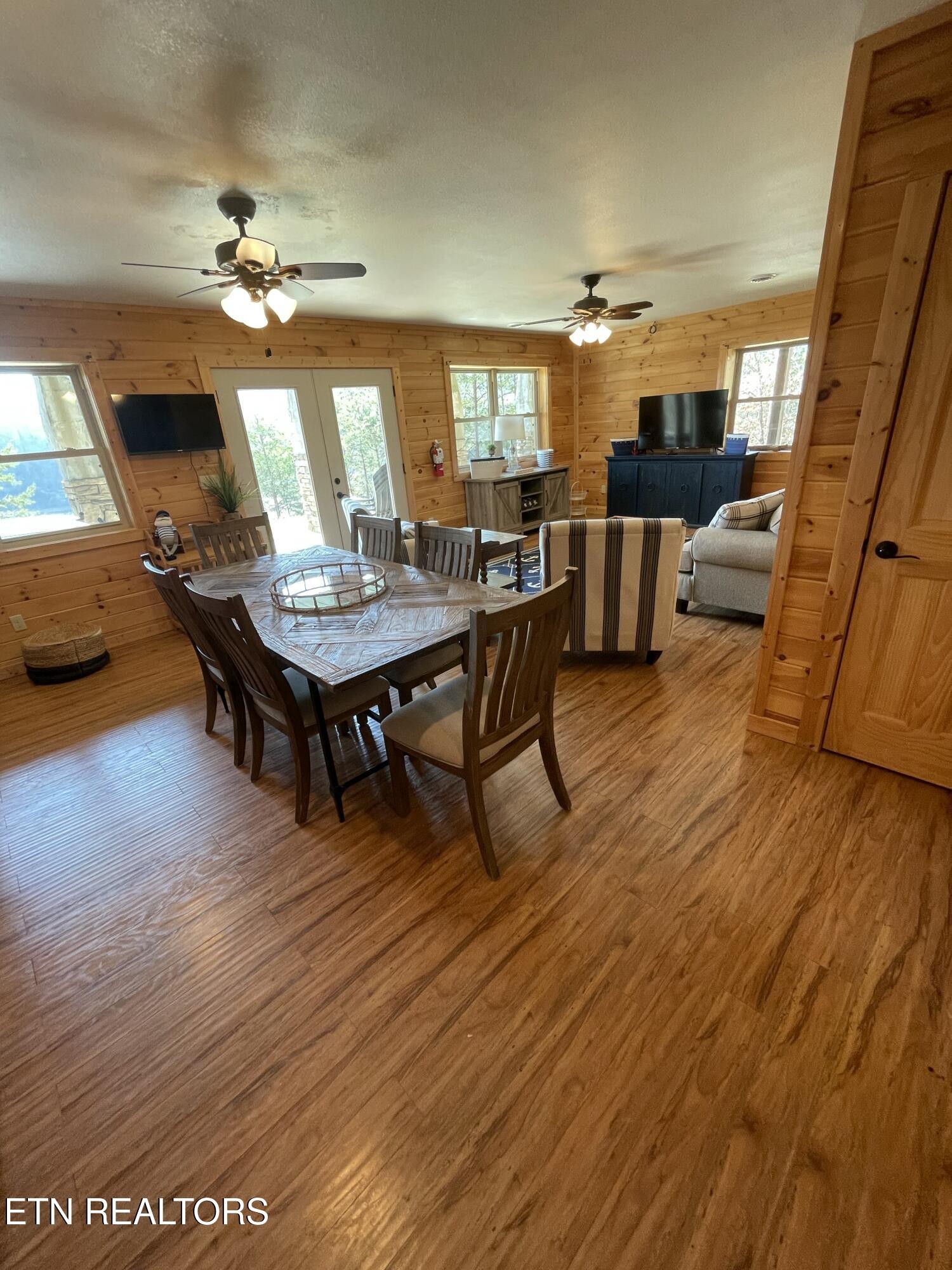 625 Bluff View Road New Tazewell, TN 37825 - Photo 29 of 57 a living room with furniture and a wooden floor