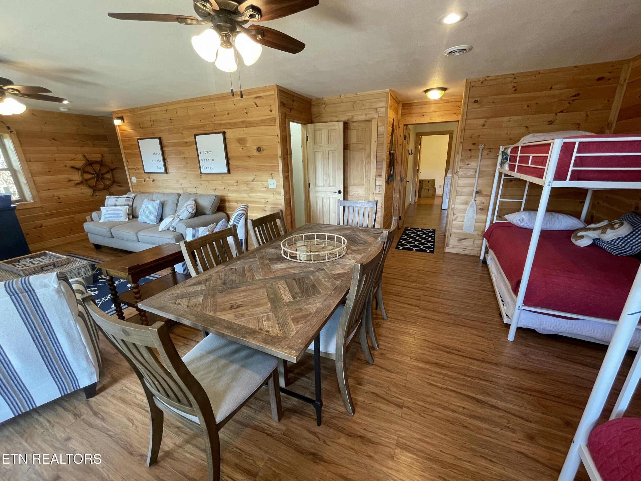 625 Bluff View Road New Tazewell, TN 37825 - Photo 30 of 57 a dining room with furniture a rug and wooden floor