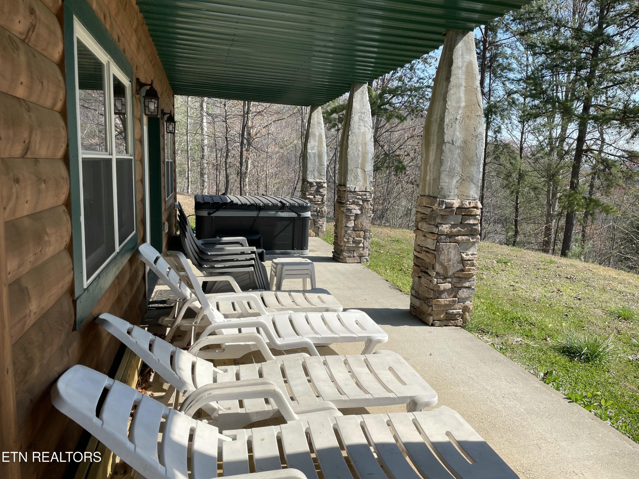 625 Bluff View Road New Tazewell, TN 37825 - Photo 37 of 57 a view of a patio with table and chairs with wooden floor and fence