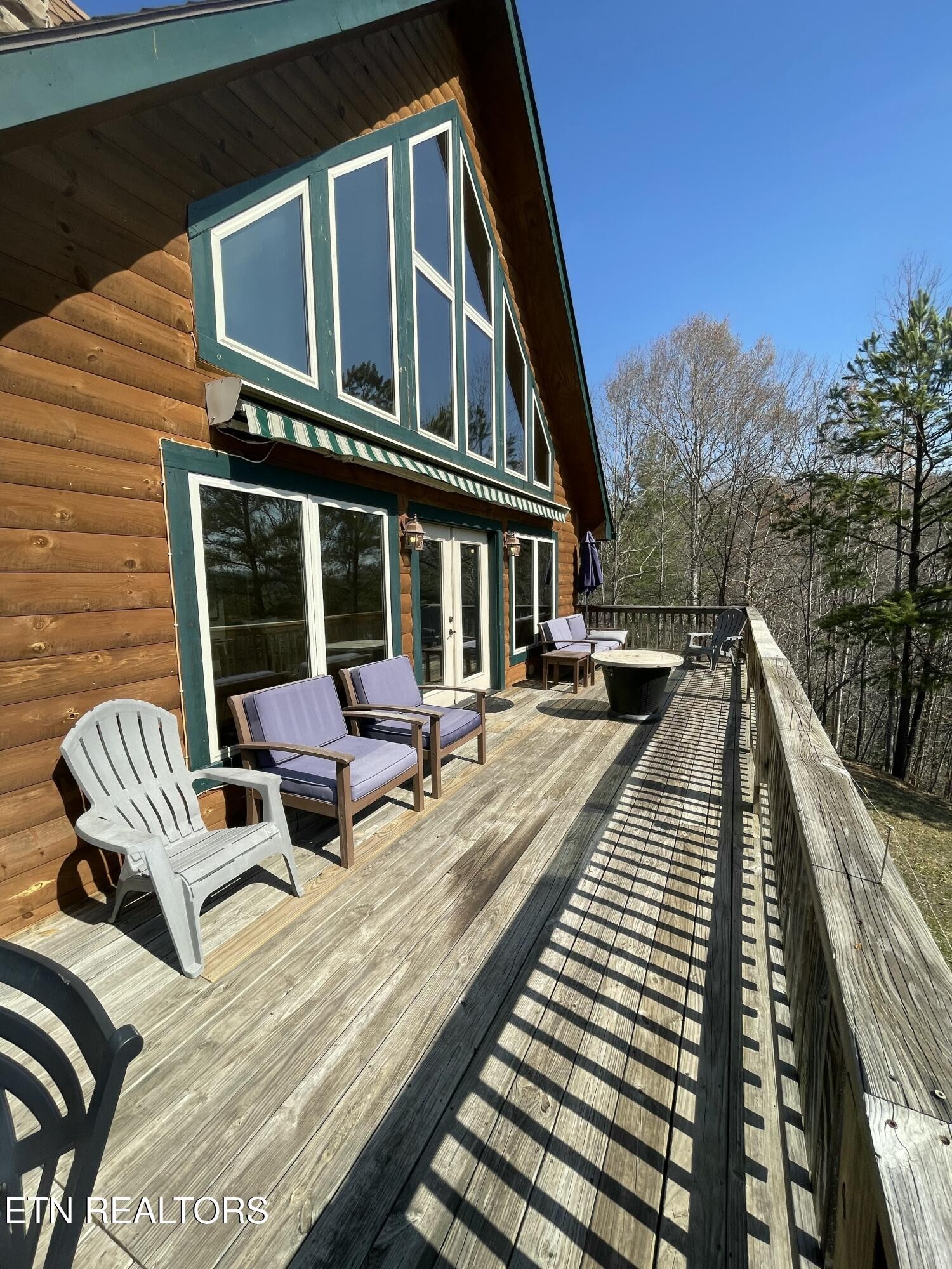 625 Bluff View Road New Tazewell, TN 37825 - Photo 42 of 57 a view of balcony with wooden floor and outdoor seating