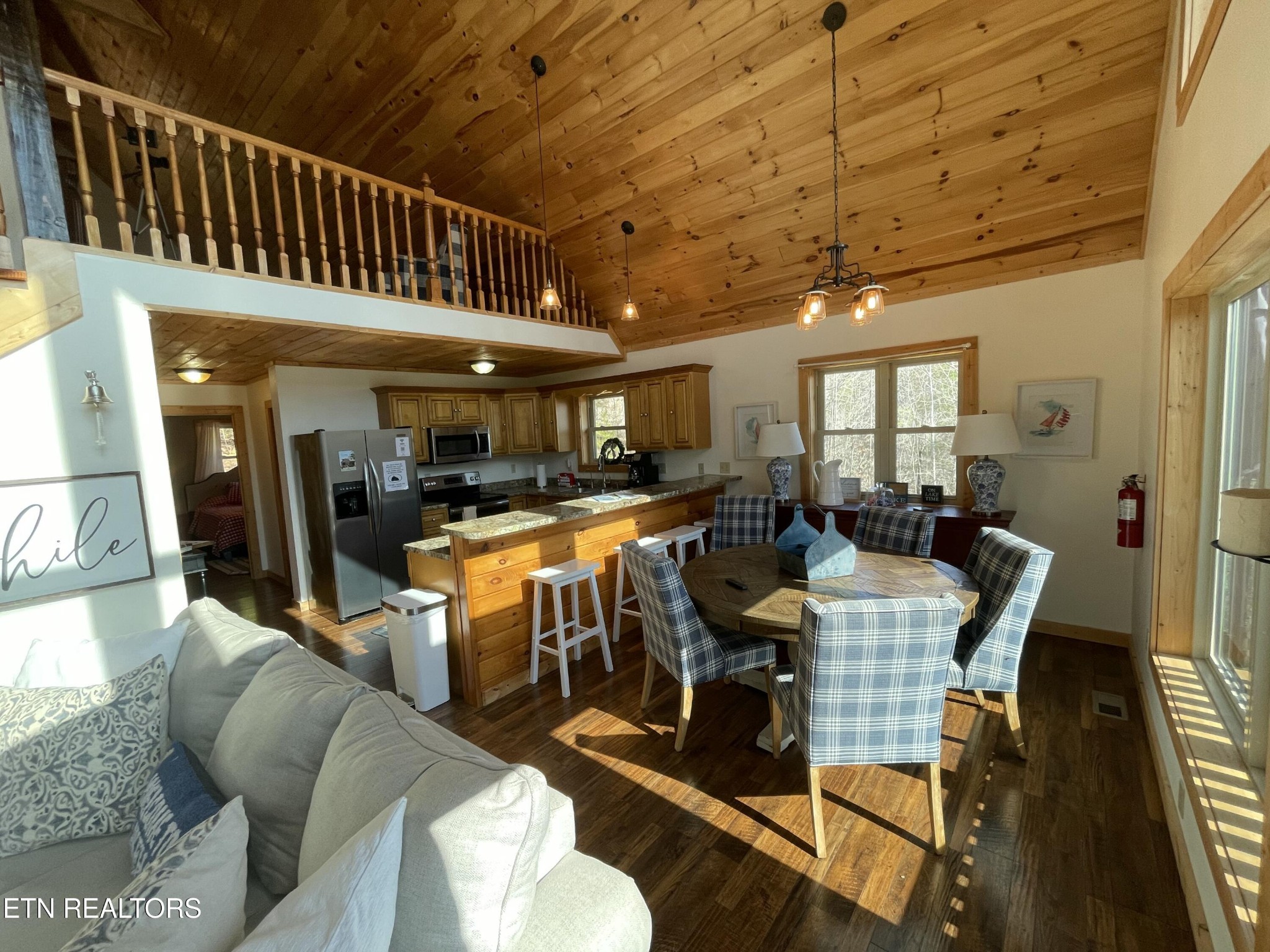 625 Bluff View Road New Tazewell, TN 37825 - Photo 5 of 57 a view of a dining room with furniture a kitchen and chandelier