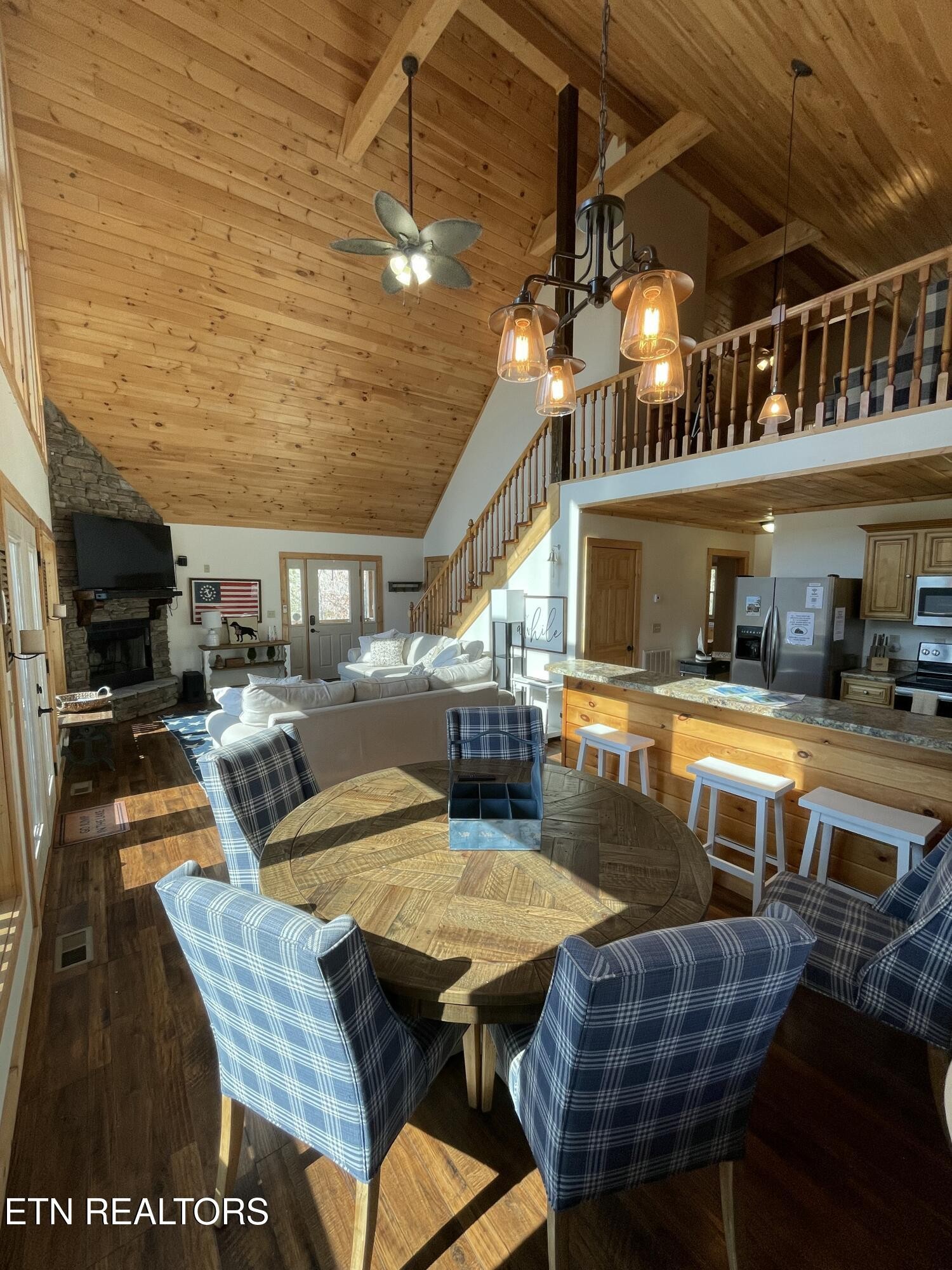 625 Bluff View Road New Tazewell, TN 37825 - Photo 6 of 57 a view of a patio with table and chairs with wooden floor