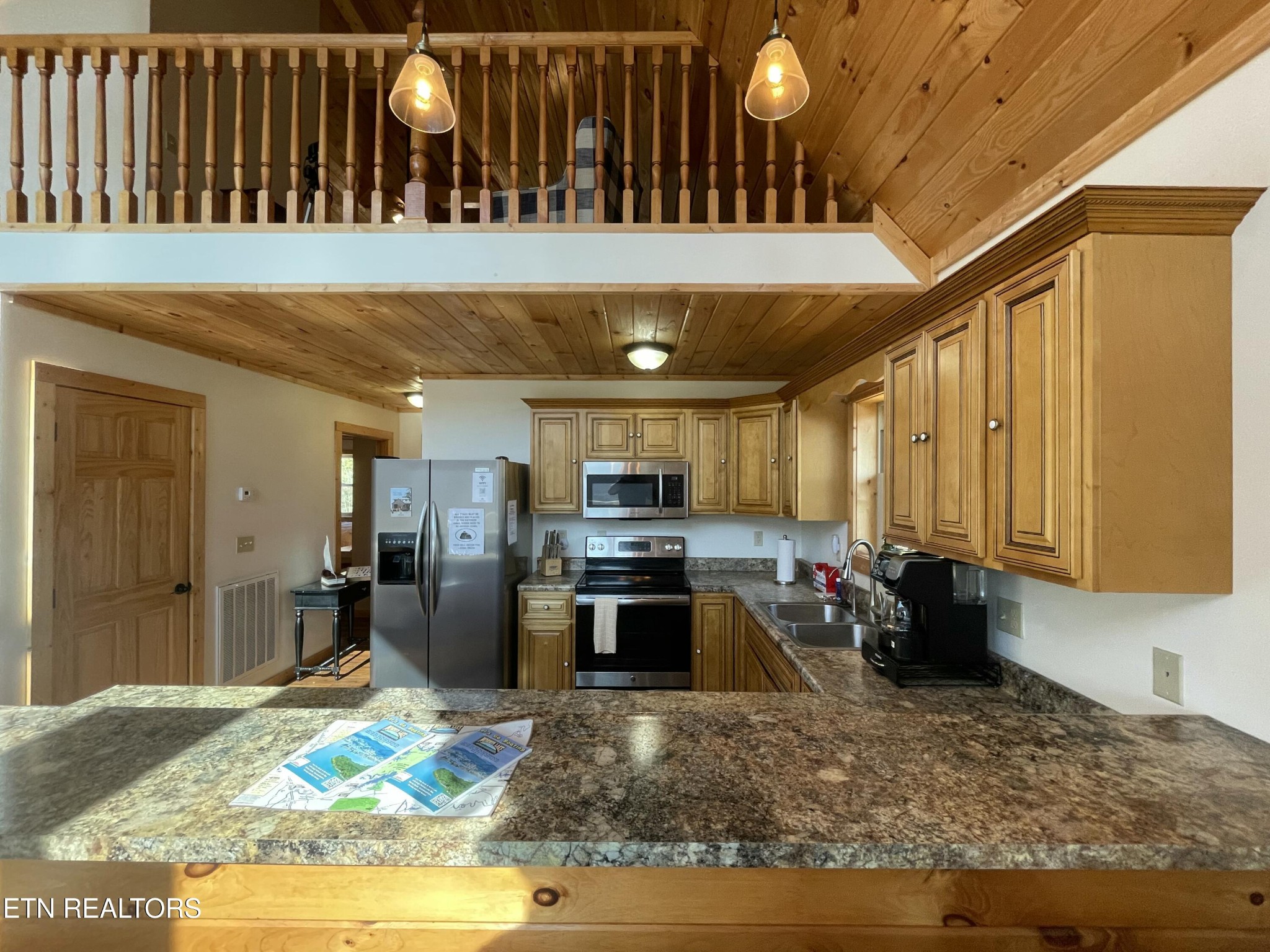 625 Bluff View Road New Tazewell, TN 37825 - Photo 8 of 57 a kitchen with stainless steel appliances granite countertop a stove refrigerator and cabinets