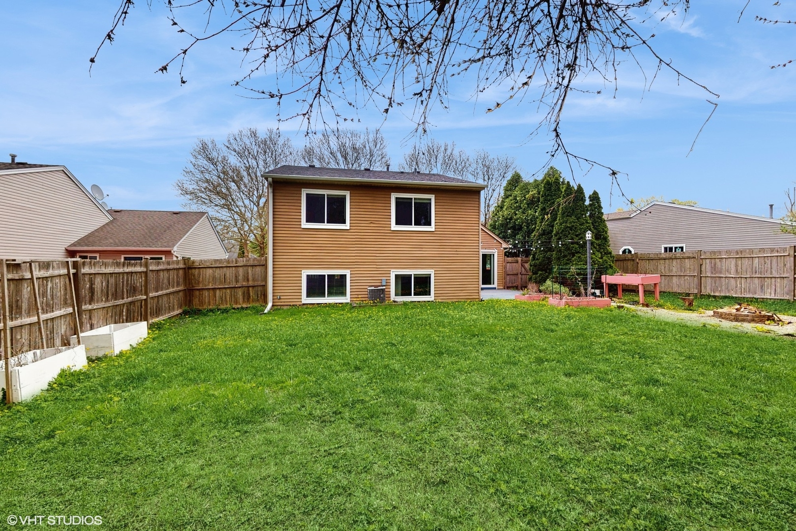 618 Hampton Circle Elgin, IL 60120 - Photo 14 of 18 a view of backyard with table and chairs and potted plants