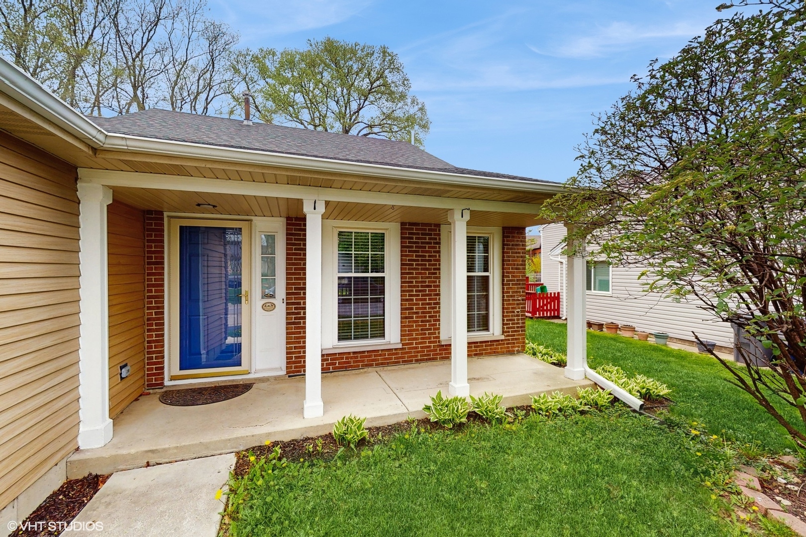618 Hampton Circle Elgin, IL 60120 - Photo 2 of 18 front view of a house with a yard