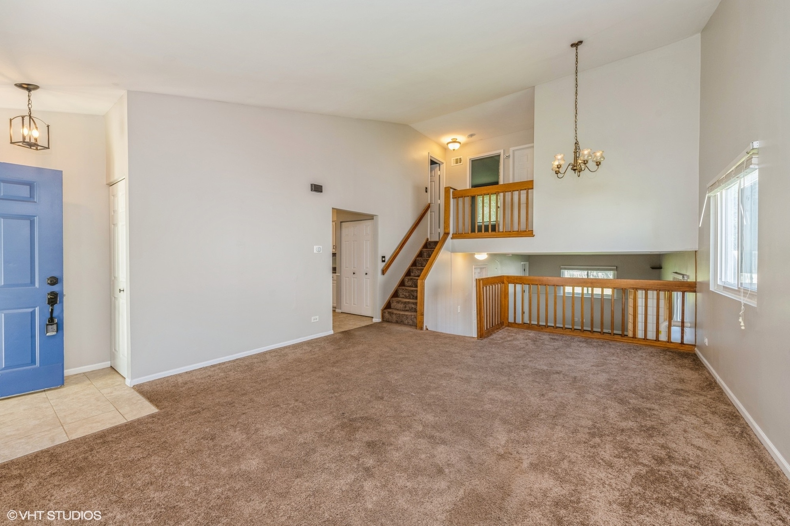 618 Hampton Circle Elgin, IL 60120 - Photo 3 of 18 a view of a livingroom with a staircase