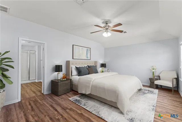 a bedroom with a bed and a couch