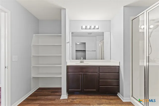 a bathroom with a sink and a mirror